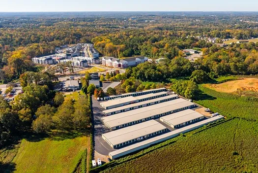Aerial perspective of multi-building self storage facility with drive-up unit access
